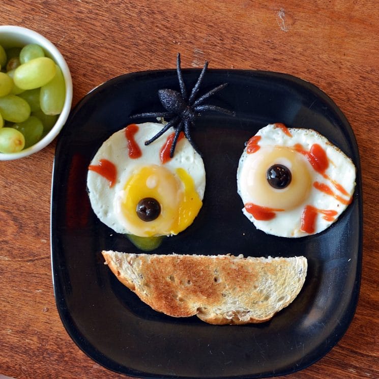 spooky breakfast with fried eggs that look like eyes